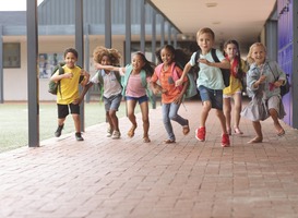 Normal_front-view-of-happy-school-kids-running-in-corrido-2021-08-28-16-43-50-utc__1_
